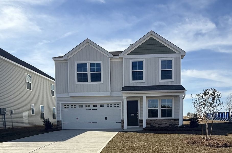 Front exterior of a new home in Winston Point, Gilbert, SC, highlighting curb appeal (Image 1).