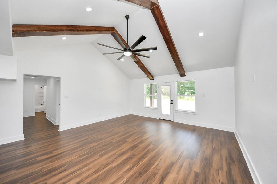 to the left of the living room are additional bedrooms.