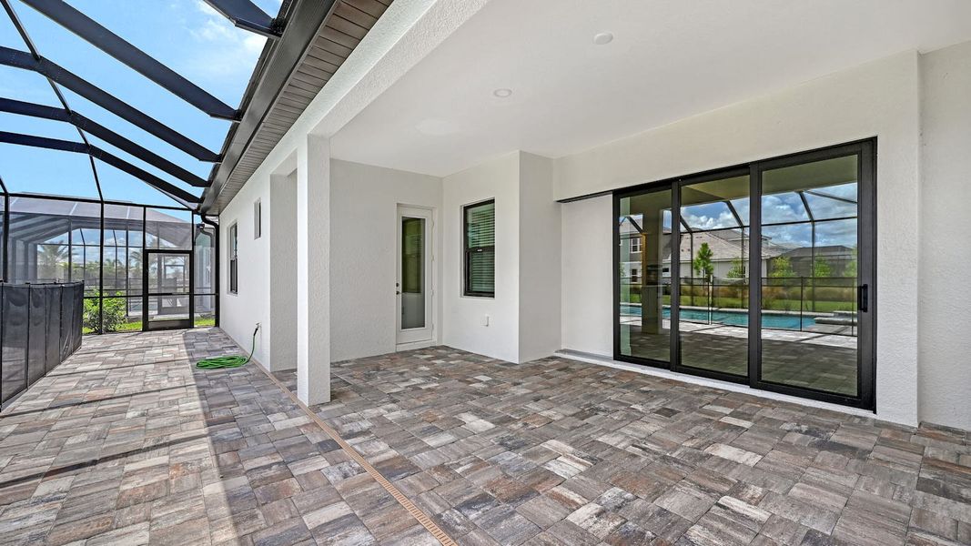Exterior details and patio area of a home in Palm Grove Real Estate and Homes for Sale in Lakewood Ranch, FL - Neal Communities, Bradenton (Image 22).