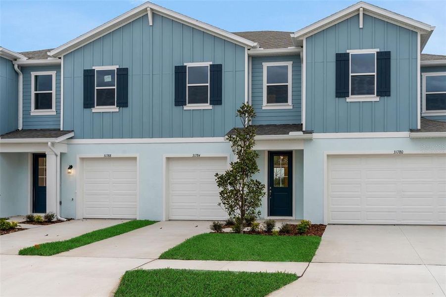 Front exterior of a new home in Shores at Mirada, San Antonio, FL, highlighting curb appeal (Image 17).