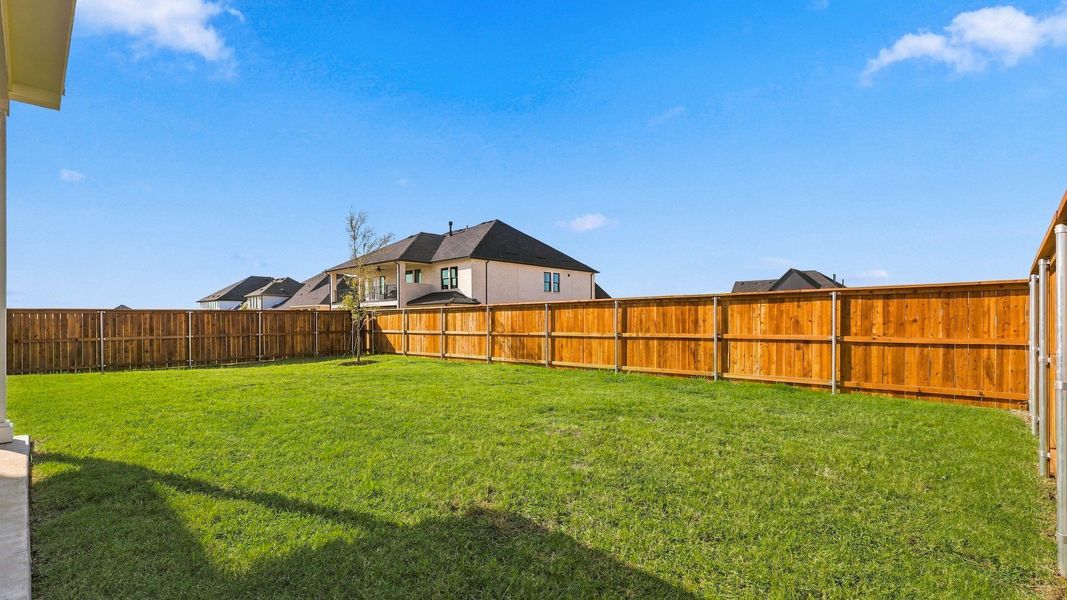 Exterior details and patio area of a home in Green Meadows Classic, Celina (Image 4).