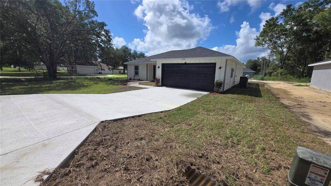 Front exterior of a new home in , Dunnellon, FL, highlighting curb appeal (Image 25).