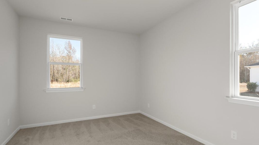 Representative unfurnished interior of a home built from the HARBOR OAK by D.R. Horton in Indigo Preserve, Leland (Image 27).
