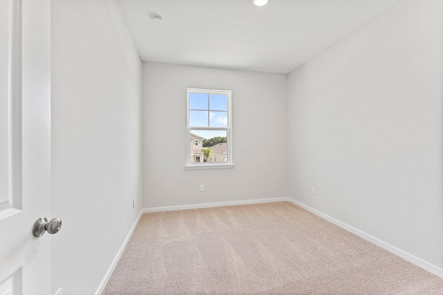 Lot 20 Ponderosa II Guest Bedroom with Window at Camden Woods in Kingsland, GA