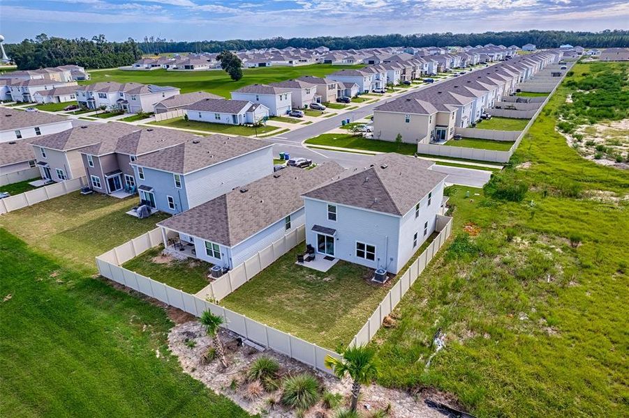 Front exterior of a new home in Avalon Woods, Newberry, FL, highlighting curb appeal (Image 24). Front exterior of a new home in Avalon Woods, Newberry, FL, highlighting curb appeal (Image 24).