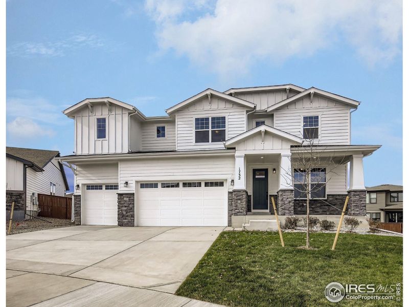 Front exterior of a new home in RainDance National 60/70, Windsor, CO, highlighting curb appeal (Image 2).