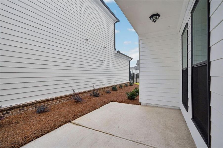Exterior details and patio area of a home in Promenade at Sawnee Village, Cumming (Image 3).
