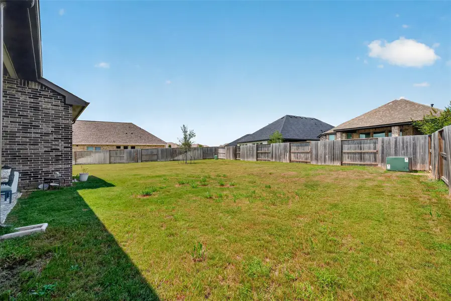 Exterior details and patio area of a home in , Iowa Colony (Image 4).