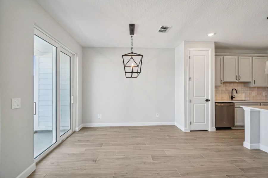 Generous dining space provides easy access to back patio