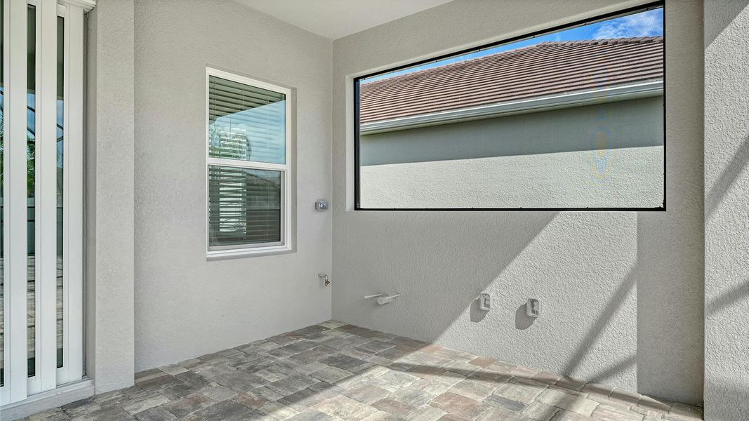 Exterior details and patio area of a home in Windward Real Estate and Homes for Sale in Sarasota, FL - Neal Communities, Lakewood Ranch (Image 26).