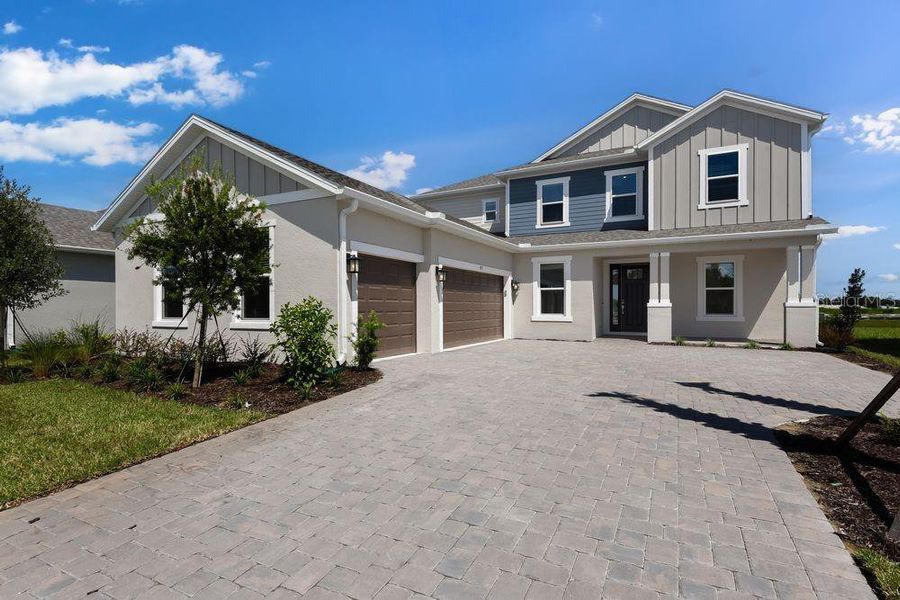 Front exterior of a new home in Ardisia Park, New Smyrna Beach, FL, highlighting curb appeal (Image 26).