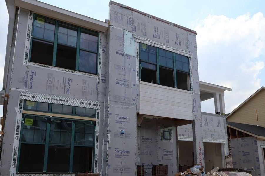 Front exterior of a new home in Easthaven at Bridgeland Central - Vision Collection, Cypress, TX, highlighting curb appeal (Image 2). Front exterior of a new home in Easthaven at Bridgeland Central - Vision Collection, Cypress, TX, highlighting curb appeal (Image 2).