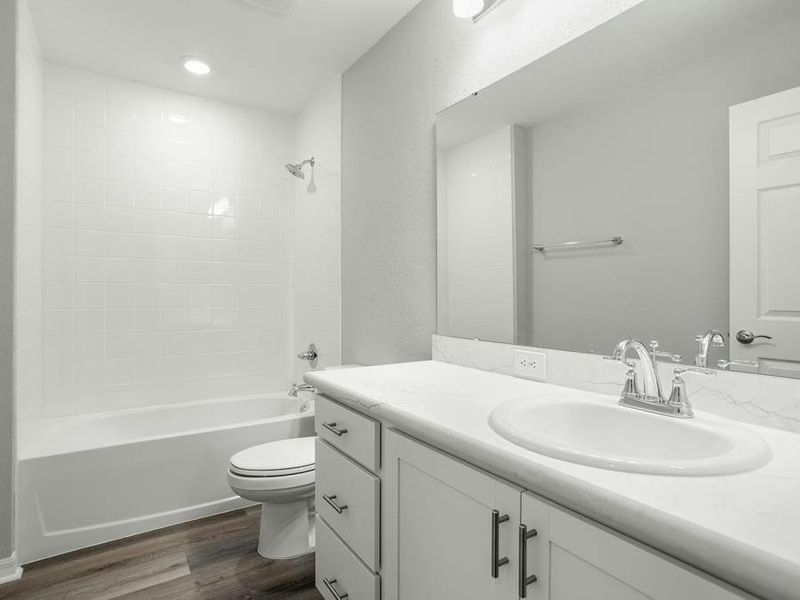 Guests and secondary bedrooms share a hall bath and linen closet.