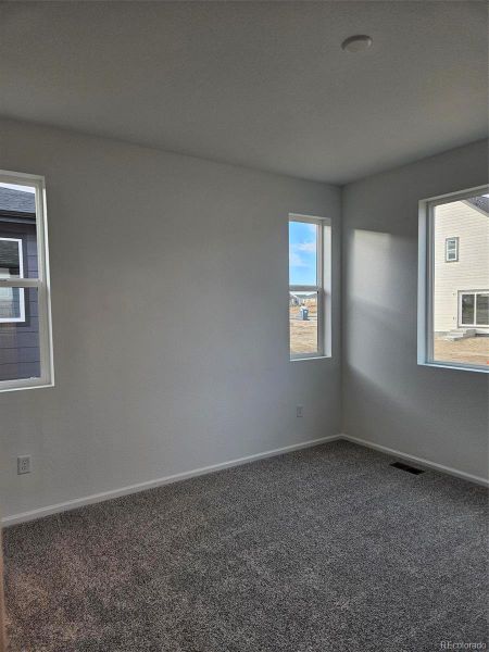 Spacious, unfurnished interior of a new home in The Cottages Collection at Ridgeline Vista, Brighton (Image 16).