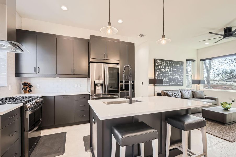 Ample cabinet storage and sleek cabinetry provide plenty of space to keep your kitchen organized and clutter-free.