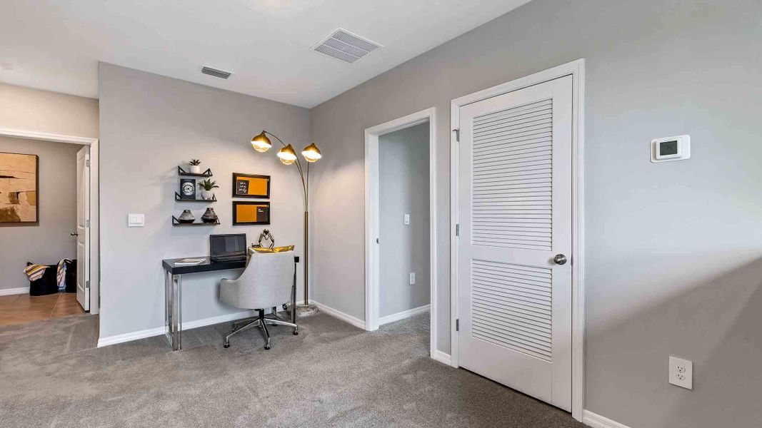 Representative furnished interior of a home built from the Robie II by D.R. Horton in Star Farms at Lakewood Ranch, Bradenton (Image 16).