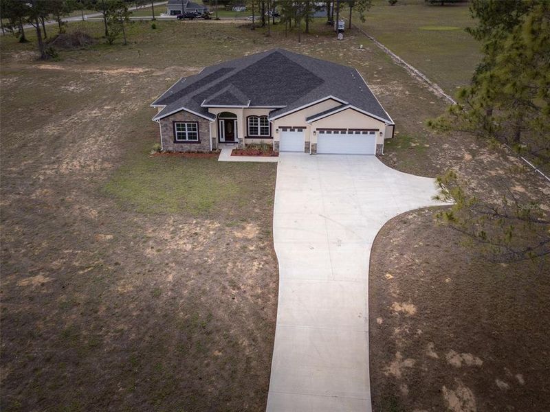 Front exterior of a new home in , Leesburg, FL, highlighting curb appeal (Image 26).