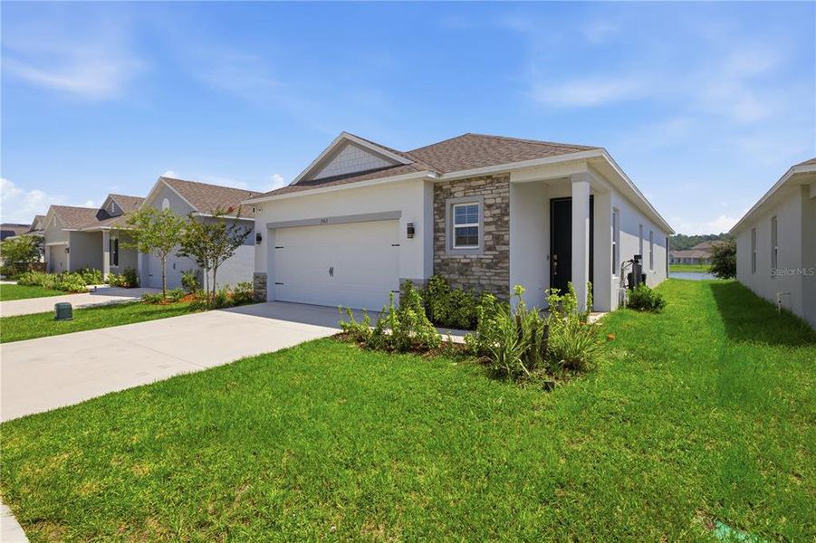 Front exterior of a new home in , Harmony, FL, highlighting curb appeal (Image 1). Front exterior of a new home in , Harmony, FL, highlighting curb appeal (Image 1).