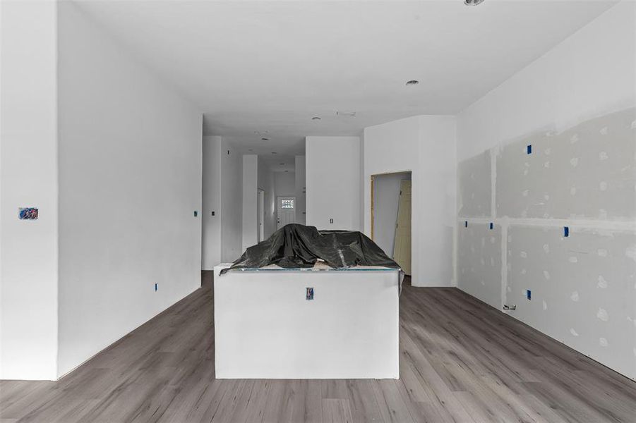 Kitchen featuring light wood-style floors and a center island Kitchen featuring light wood-style floors and a center island