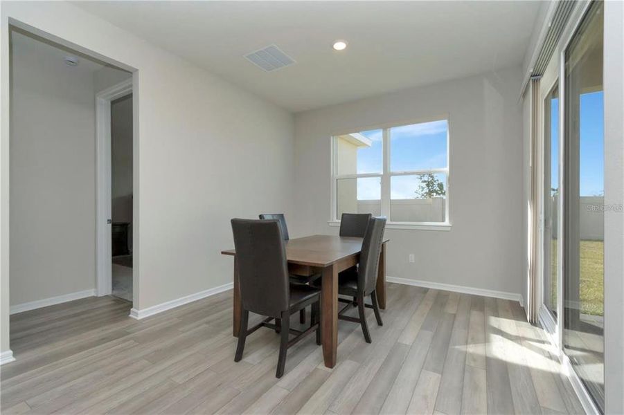 Furnished interior view inside a new home in Tohoqua Reserve, Kissimmee (Image 6).
