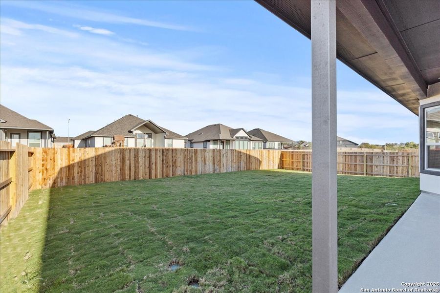 Exterior details and patio area of a home in Village at Three Oaks, Seguin (Image 3).