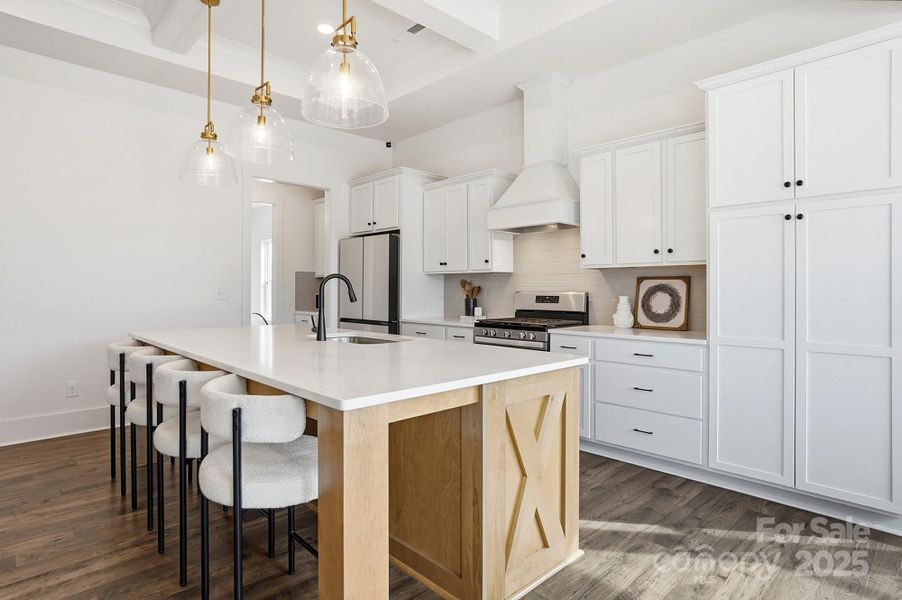 Open Kitchen with Quartz Countertops and Large Island