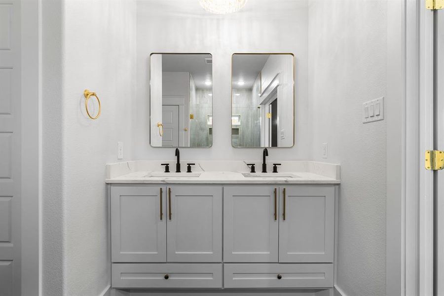 Bathroom with vanity and a shower