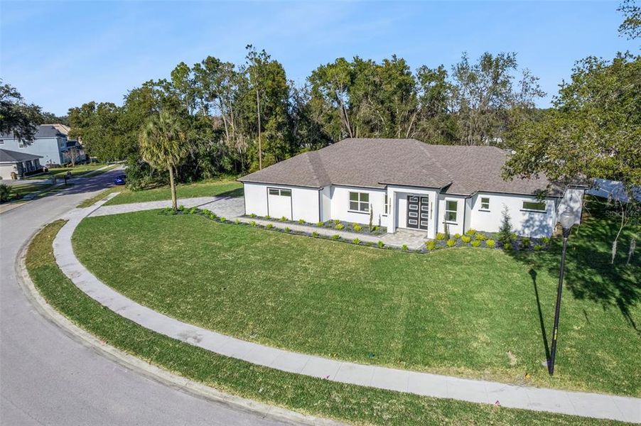 Front exterior of a new home in , Leesburg, FL, highlighting curb appeal (Image 25).