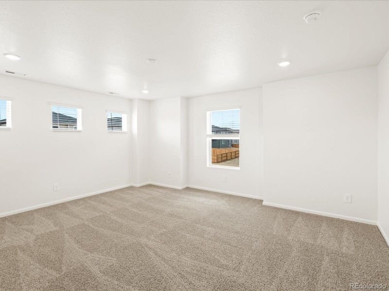 Spacious, unfurnished interior of a new home in Ridgeline Vista: The Flora Collection, Brighton (Image 21).