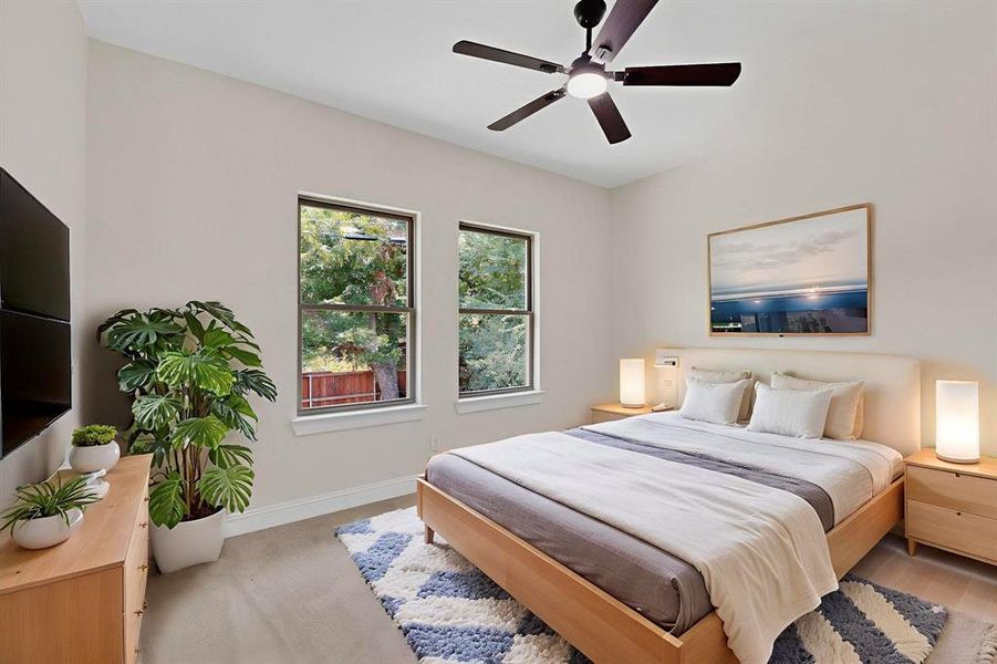 Bedroom featuring baseboards and a ceiling fan Bedroom featuring baseboards and a ceiling fan