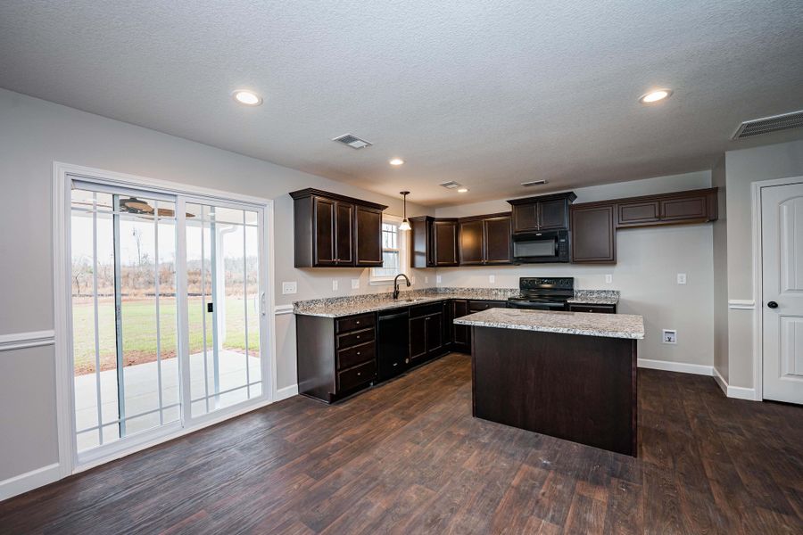 Representative furnished interior of a home built from the Saxon by Enchanted Homes in Guadalupe Heights, Seguin (Image 15).