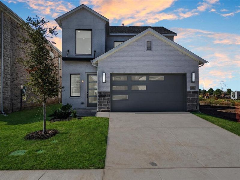 Front exterior of a new home in Royal Court, Frisco, TX, highlighting curb appeal (Image 1).