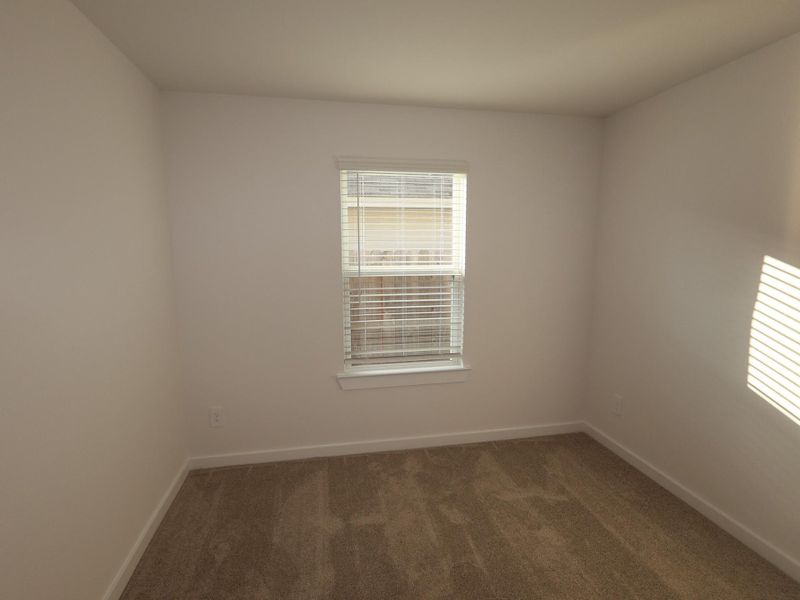Spacious, unfurnished interior of a new home in Pinewood at Grand Texas, New Caney (Image 23).
