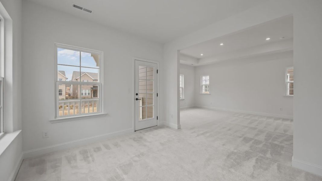 The Brentwood Plan by DRB Homes in River District, Charlotte NC.- Primary Bedroom with Sitting Area The Brentwood Plan by DRB Homes in River District, Charlotte NC.- Primary Bedroom with Sitting Area