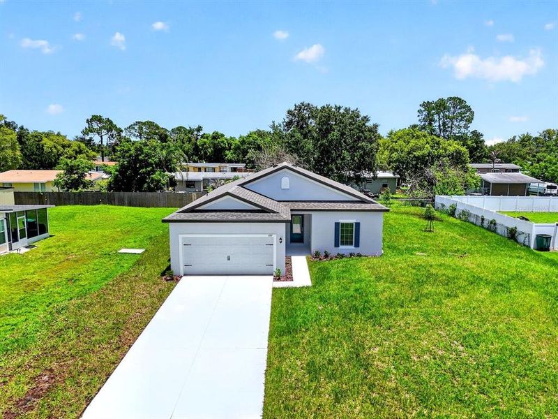 Front exterior of a new home in , Deltona, FL, highlighting curb appeal (Image 2). Front exterior of a new home in , Deltona, FL, highlighting curb appeal (Image 2).