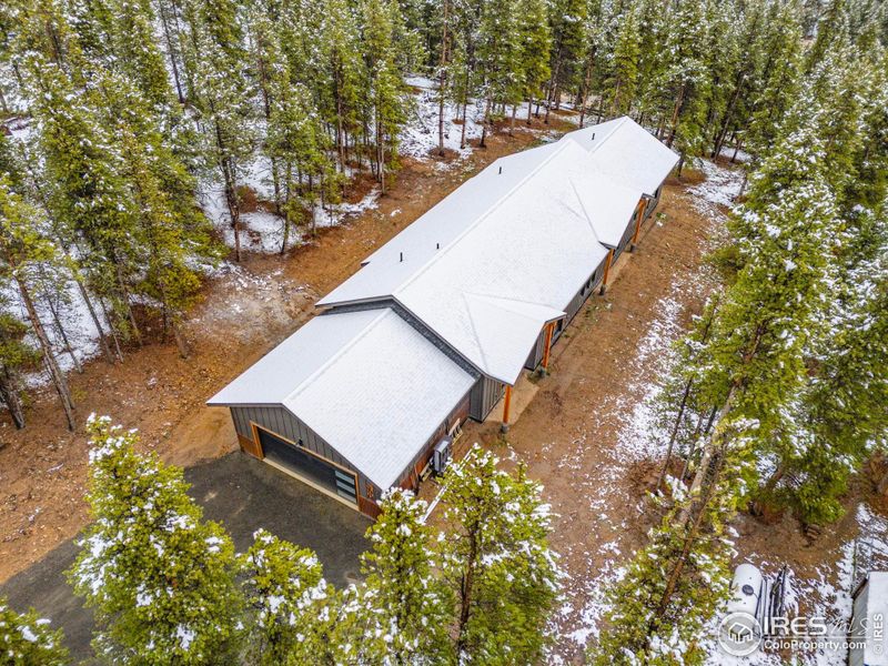Aerial view of the home with extensive fire mitigation around the entire house. Aerial view of the home with extensive fire mitigation around the entire house.