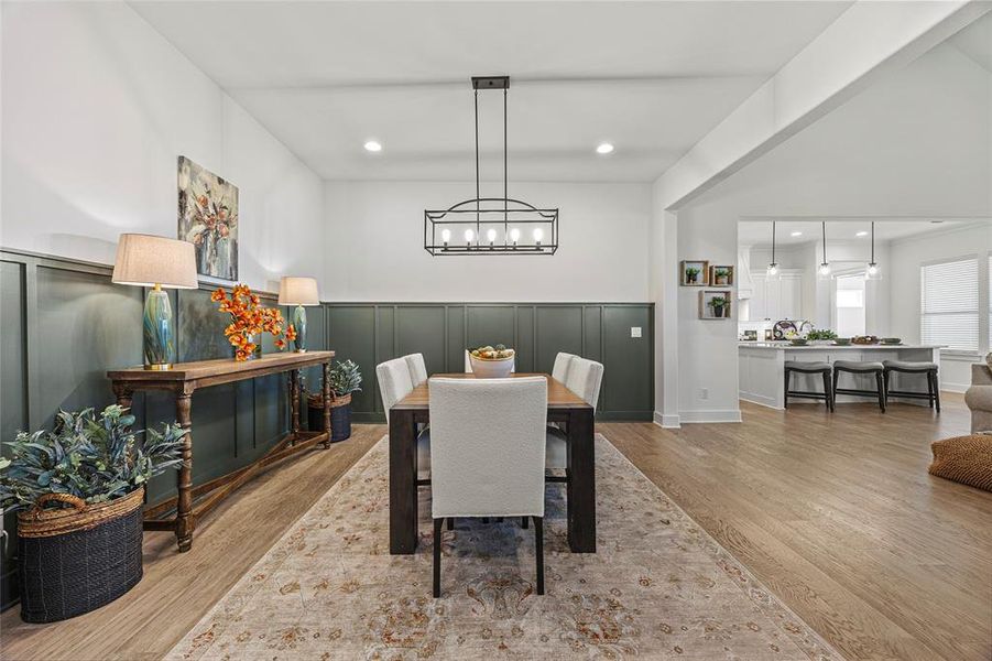 Dining space featuring hardwood / wood-style floors and a chandelier