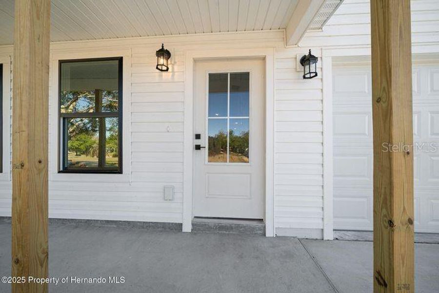 Front exterior of a new home in , Weeki Wachee, FL, highlighting curb appeal (Image 2). Front exterior of a new home in , Weeki Wachee, FL, highlighting curb appeal (Image 2).