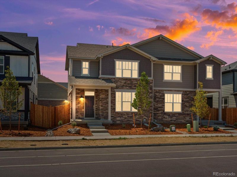 Front exterior of a new home in Horizon Uptown: The Mountain Collection, Aurora, CO, highlighting curb appeal (Image 2). Front exterior of a new home in Horizon Uptown: The Mountain Collection, Aurora, CO, highlighting curb appeal (Image 2).