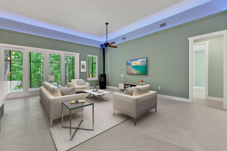 Virtually staged - flow through the front door into the spacious living area with soaring ceilings, ambient lighting, and wall-to-wall windows framing peaceful wooded views.