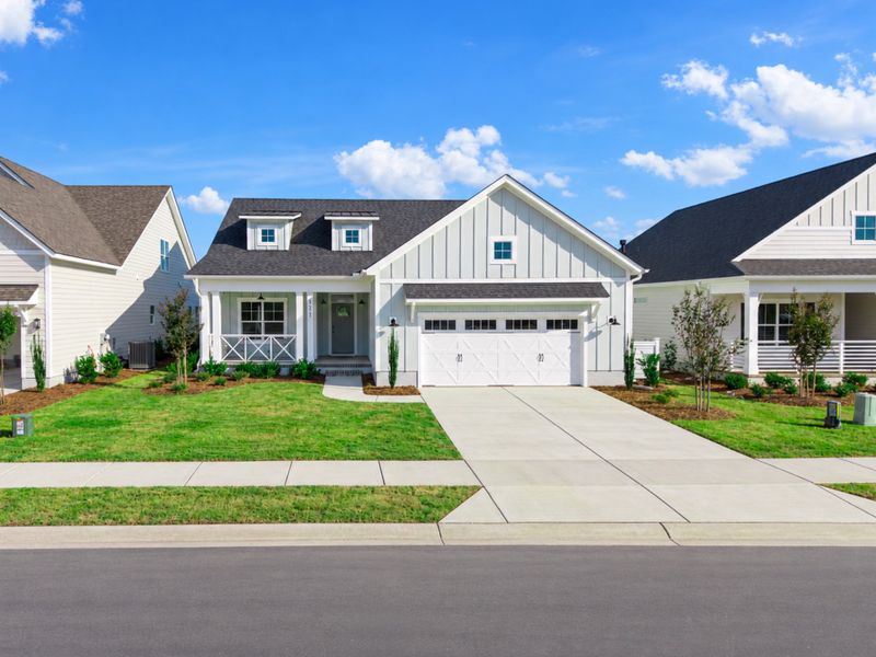 Front exterior of a new home in Sidbury Landing, Wilmington, NC, highlighting curb appeal (Image 27).