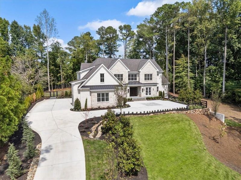 Front exterior of a new home in , Milton, GA, highlighting curb appeal (Image 2). Front exterior of a new home in , Milton, GA, highlighting curb appeal (Image 2).