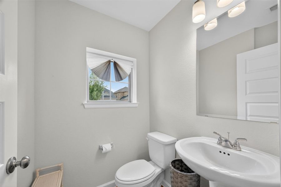 Convenient half bath located right at the front of the home. Convenient half bath located right at the front of the home.