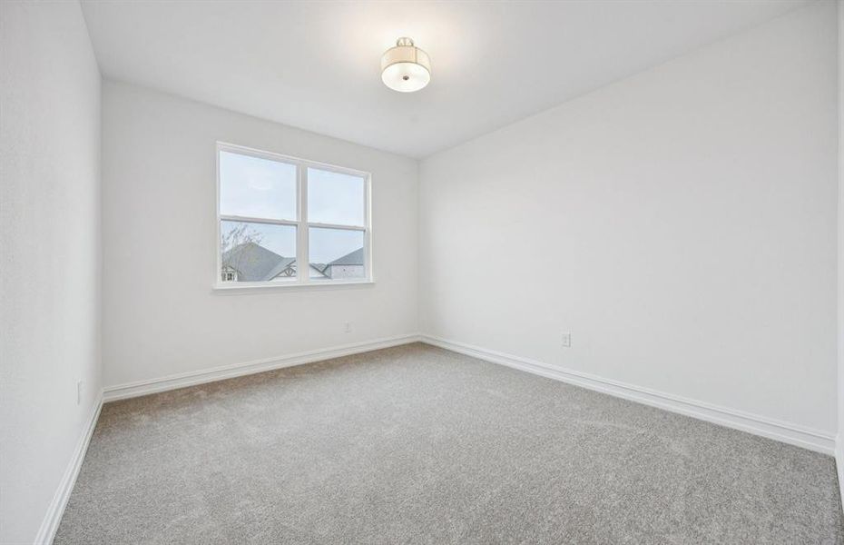 Comfortable secondary bedroom with generous closet space