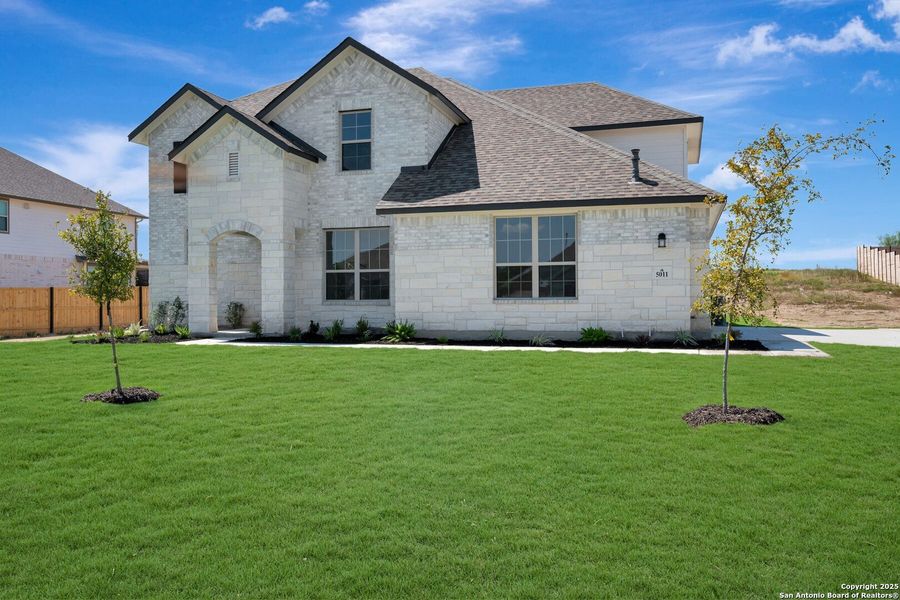 Front exterior of a new home in Everly Estates, San Antonio, TX, highlighting curb appeal (Image 13). Front exterior of a new home in Everly Estates, San Antonio, TX, highlighting curb appeal (Image 13).