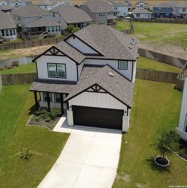 Front exterior of a new home in Lily Springs, Seguin, TX, highlighting curb appeal (Image 23). Front exterior of a new home in Lily Springs, Seguin, TX, highlighting curb appeal (Image 23).