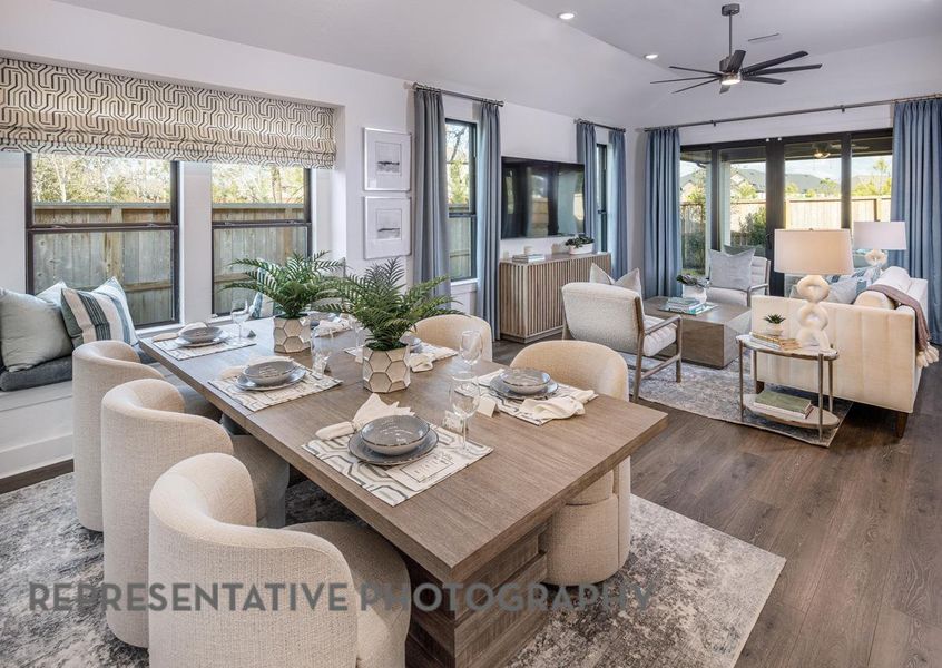 Dining room featuring dark wood-style floors, ceiling fan, recessed lighting, and vaulted ceiling Dining room featuring dark wood-style floors, ceiling fan, recessed lighting, and vaulted ceiling