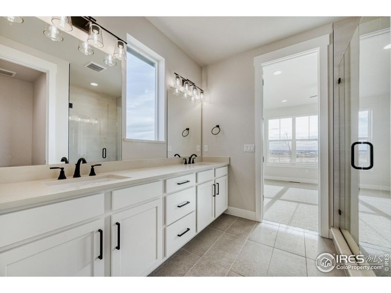 Furnished interior view inside a new home in Barefoot Lakes, Firestone (Image 10).