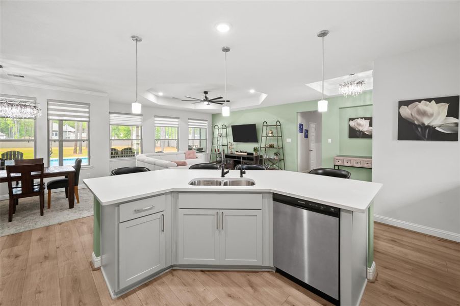 Kitchen opens to the dining and family rooms, creating an easy flow for everyday living and entertaining.