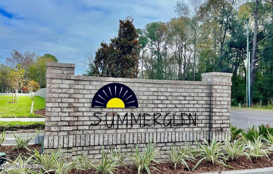 Front exterior of a new home in Summerglen, Jacksonville, FL, highlighting curb appeal (Image 15).
